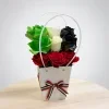 UAE National Day flowers arrangement with green white black and red roses in white handle gift bag